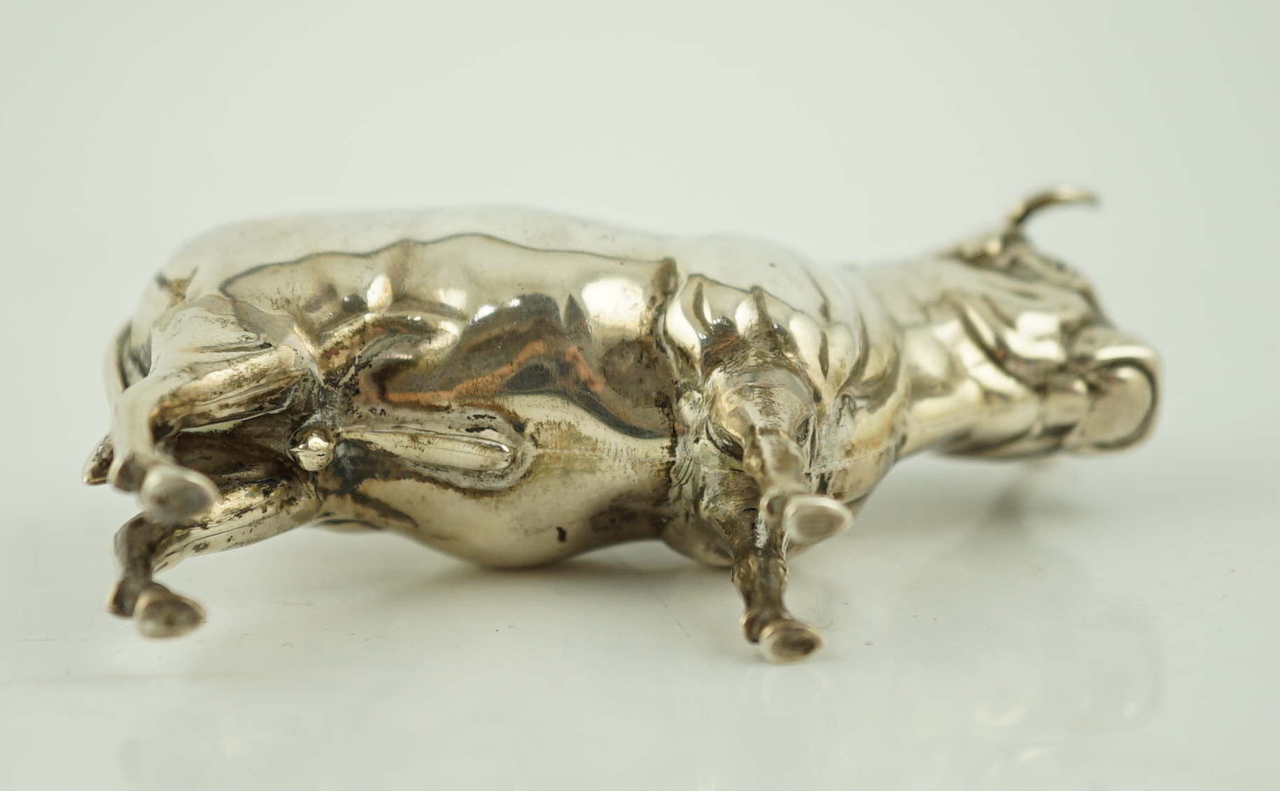 An Edwardian novelty silver pin cushion, modelled as a bull, Cohen & Charles